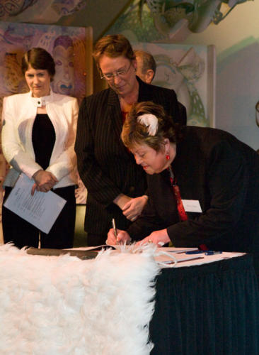 shirley-signing-for-hokotehi-with-helen-clark (1)